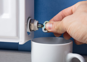 Using radiator key to bleed radiator