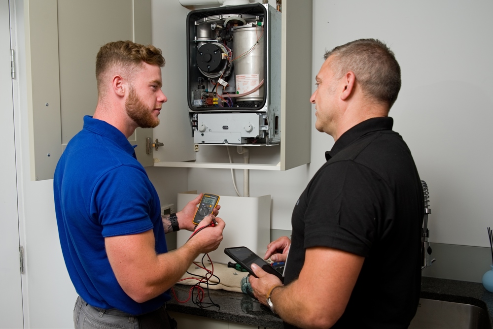 Apprentice Being Trained Working On A Boiler (1)