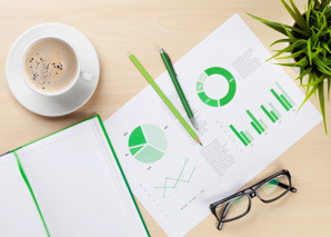 Office Workplace With Charts Plant Notepad